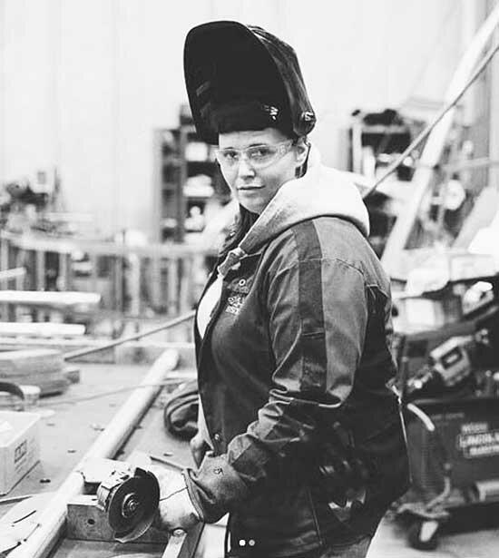 The first photo taken of Ember in 2019 with her welding/working attire for her portfolio, located at Landscape Structures Inc. of Delano, a custom weld shop where she works during the day. (Photo by Lanny Linehan)