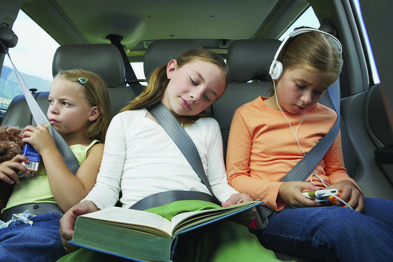 Parents can utilize these four strategies to keep kids occupied on long car trips.