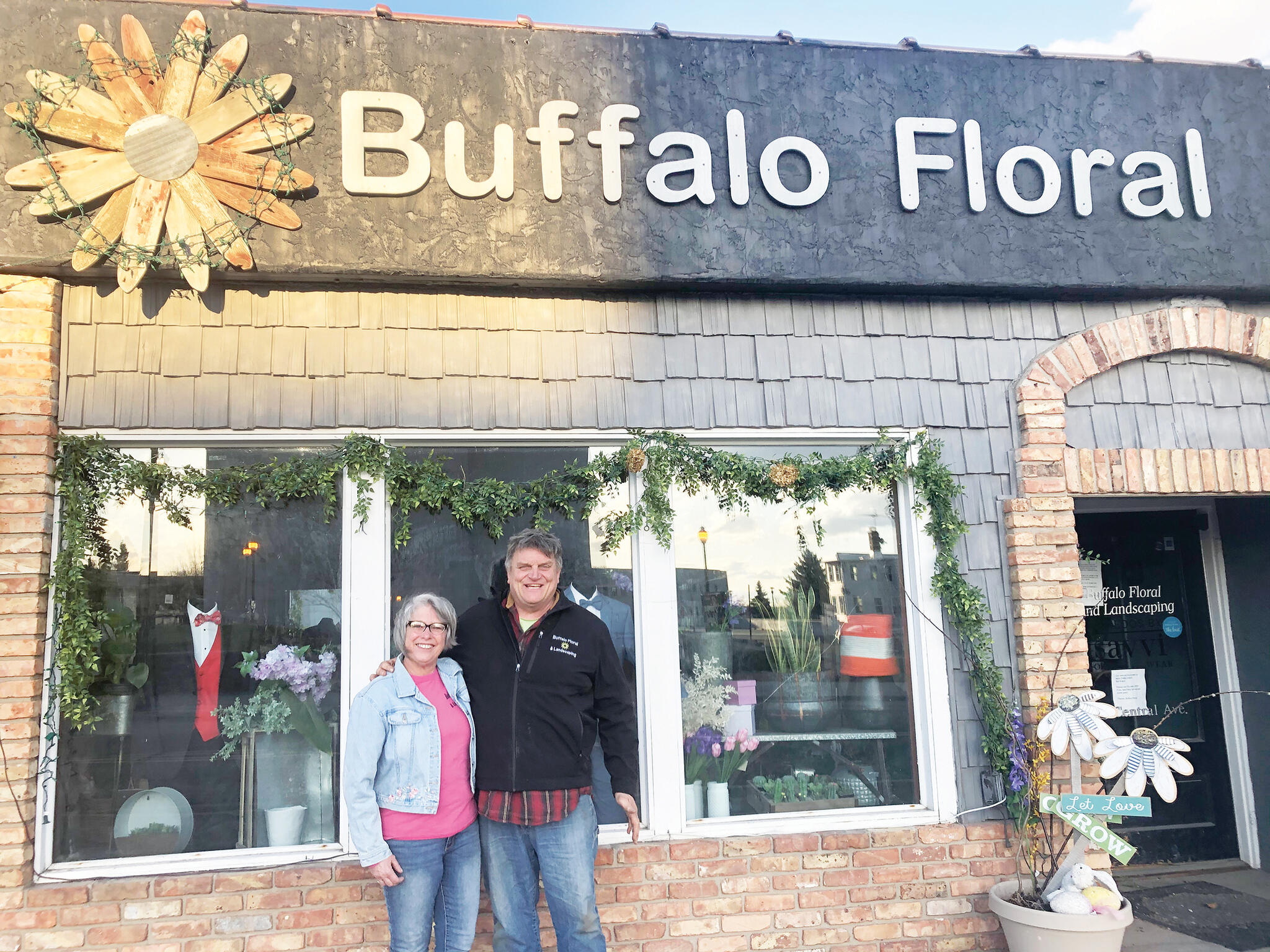 Tim and Patty Speckel stand in front of Buffalo Floral for a photo taken in 2020, a shop they owned for 41 years. The Speckels recently sold the flower shop to Brent and Janine Kohlbeck, of Buffalo. Sale of the shop does not mean retirement for this busy pair, the Speckels will continue to operate their landscaping business, along with Buffalo Hills Tree Farm. (Submitted photos)