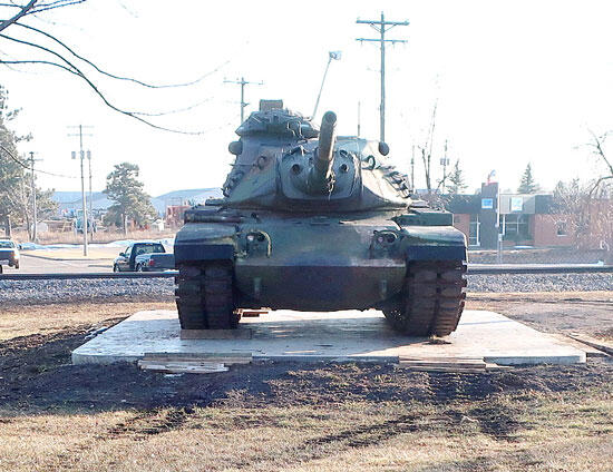 Front view of the M60A3 tank displayed on a new cement slab.