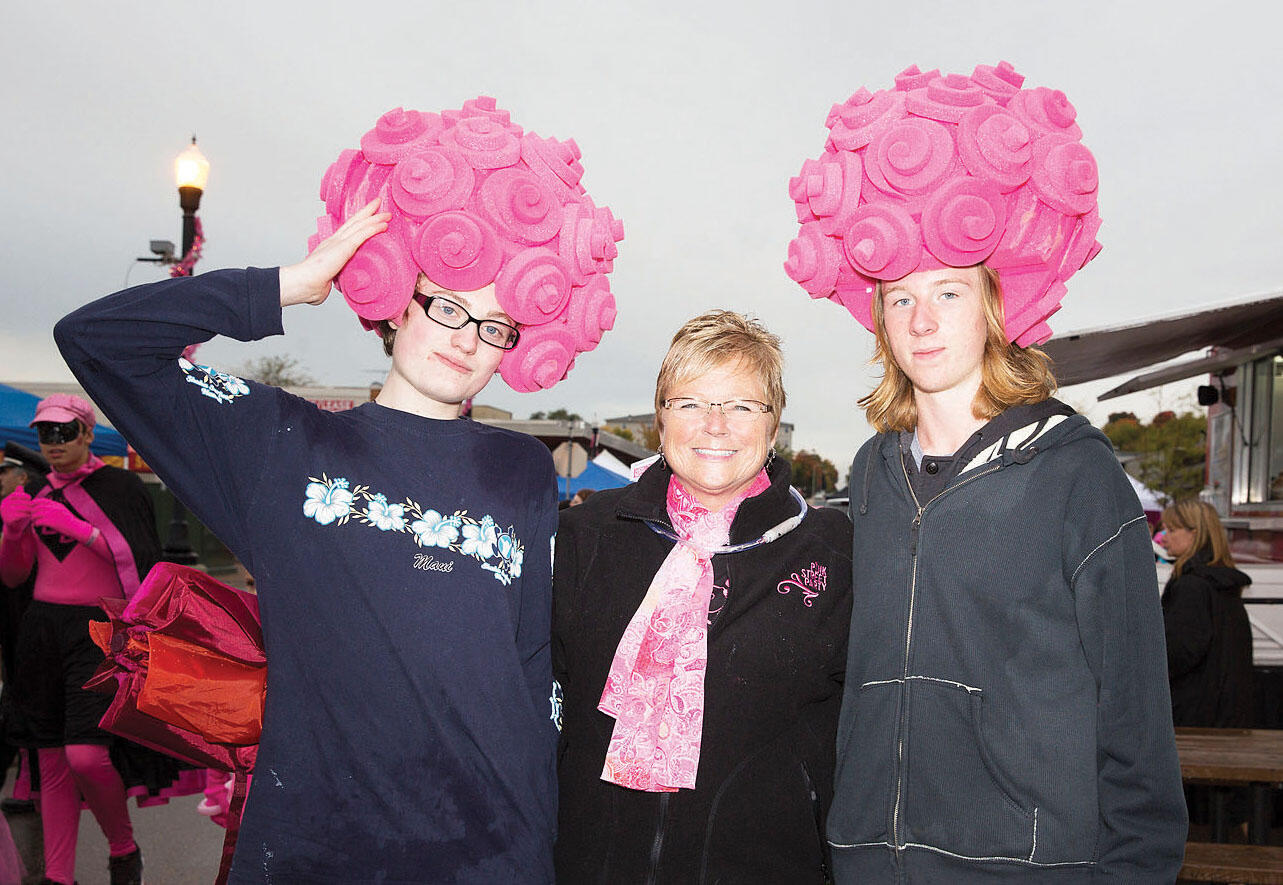 Karla Heeter (center) served as Buffalo Hospital Foundation director in 2009, helping to lead the first Pink Street Party which raised $38,000 for breast cancer awareness. Pictured with Karla (in 2011) is Bridget Fruth (left) and Josh Medley (right).