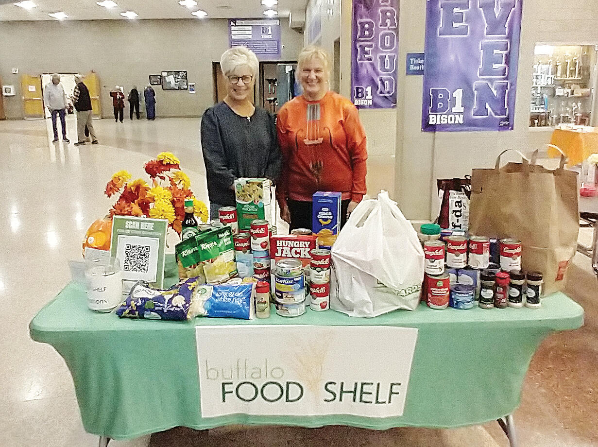 The Community orchestra “hotdish” food drive, organized by Erin Walsh (right), provided an opportunity for orchestra concert attendees to donate much-needed items to the Buffalo Food Shelf. Pictured with Erin is Buffalo Food Shelf Associate Director Lori Olson (left).