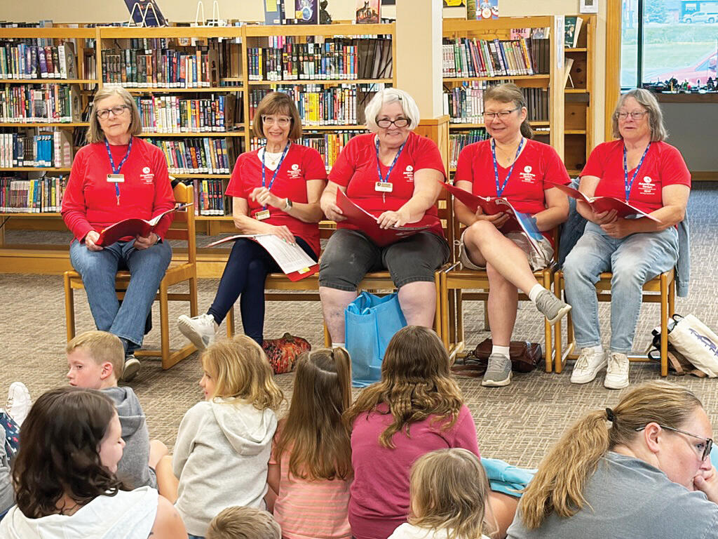 AmeriCorp Seniors RSVP, Readers Theater volunteers read for listeners at the Maple Lake library on June 17. Pictured from L to R: Jane Erickson, Francie Karpen, Lucinda McCoy, Rosanna Chambliss, and Sharon Olson. Not pictured: Maribeth Schulke. (Submitted photo)