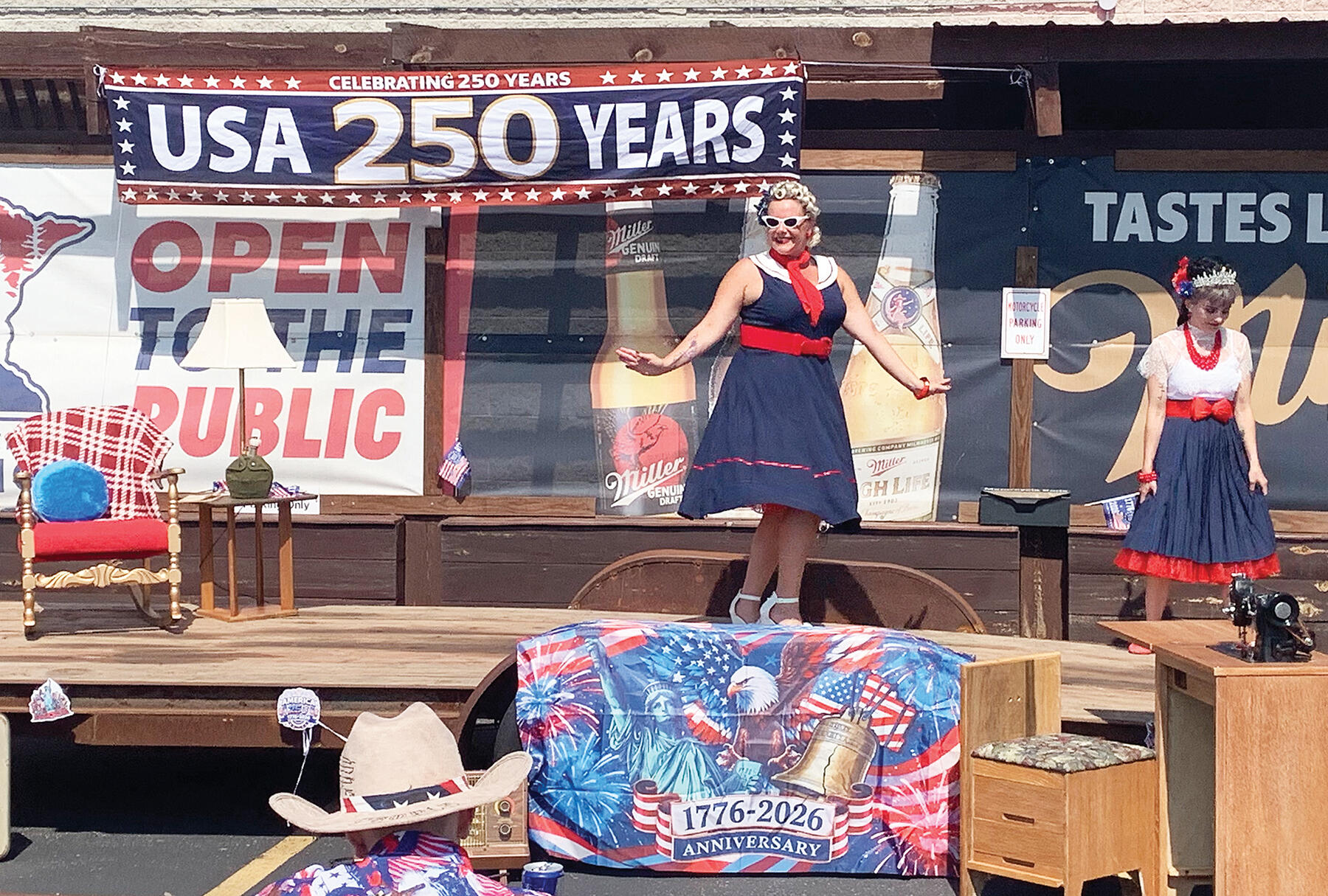 Trixie Pearl (center), who assisted with event coordination and organization, drew a lot of cheers from the crowd as she took the stage during the pin-up competition. On stage with Trixie is Miss Marvis Mayham (right).