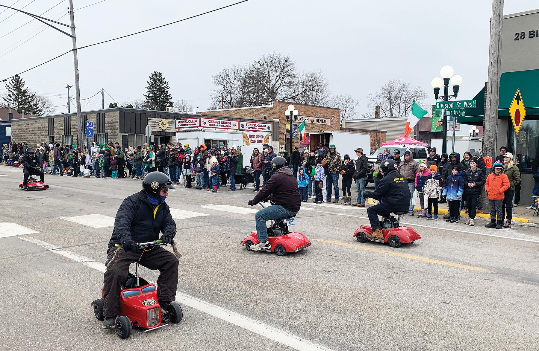 The award-winning Osman Mighty Mites zipped around Division Street on tiny, motorized vehicles. The Mighty Mites support Shriners Hospitals for children.