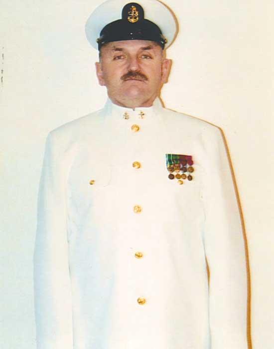 Edwards attending the Navy Ball in U.S. Navy Full Dress Whites, commonly referred to as “Choker” whites, due to them being tight around the collar.