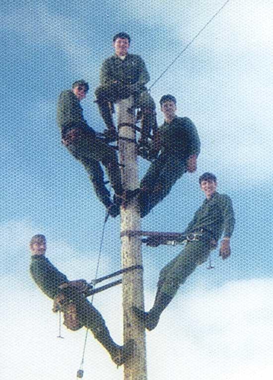 Hanging out with friends on top of 40’ power pole while stationed at US Naval Station Adak, Alaska. Assigned to public works High Voltage line crew. Edwards is on top.