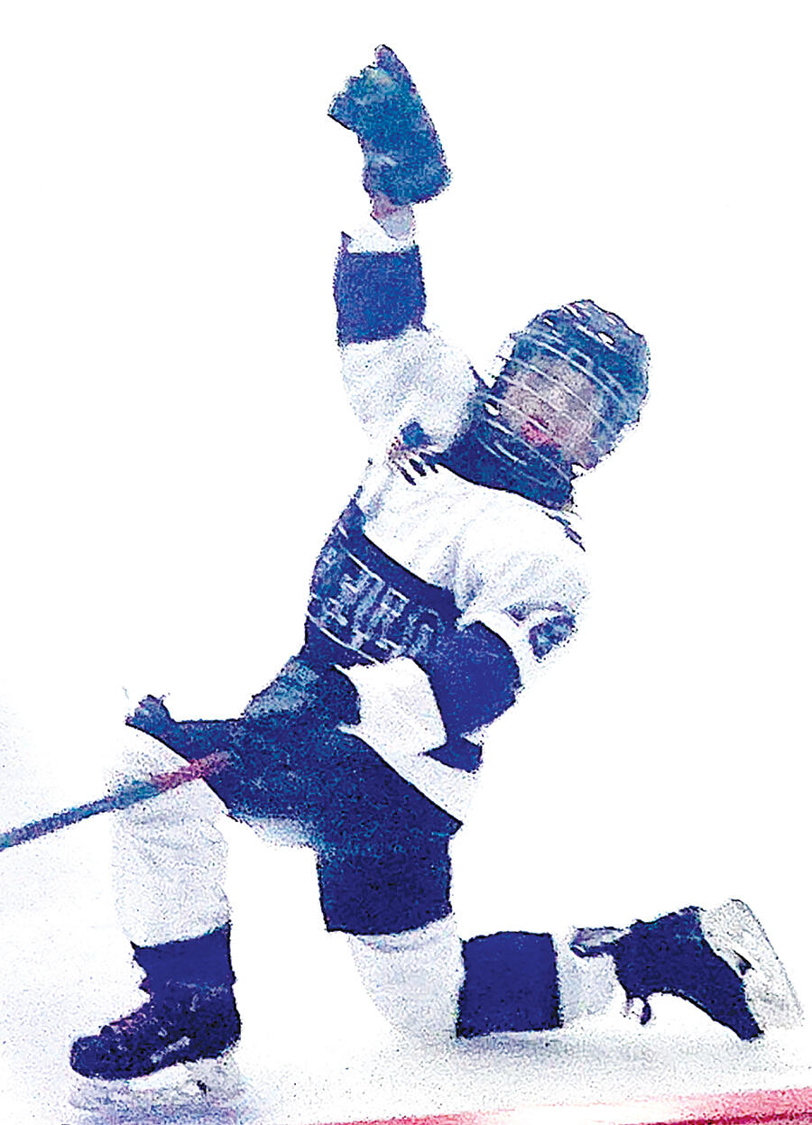 Solomon (above) goes to one knee to celebrate a goal during one of her tournament games playing for the Buffalo Bombers 12U Black girls’ hockey team.