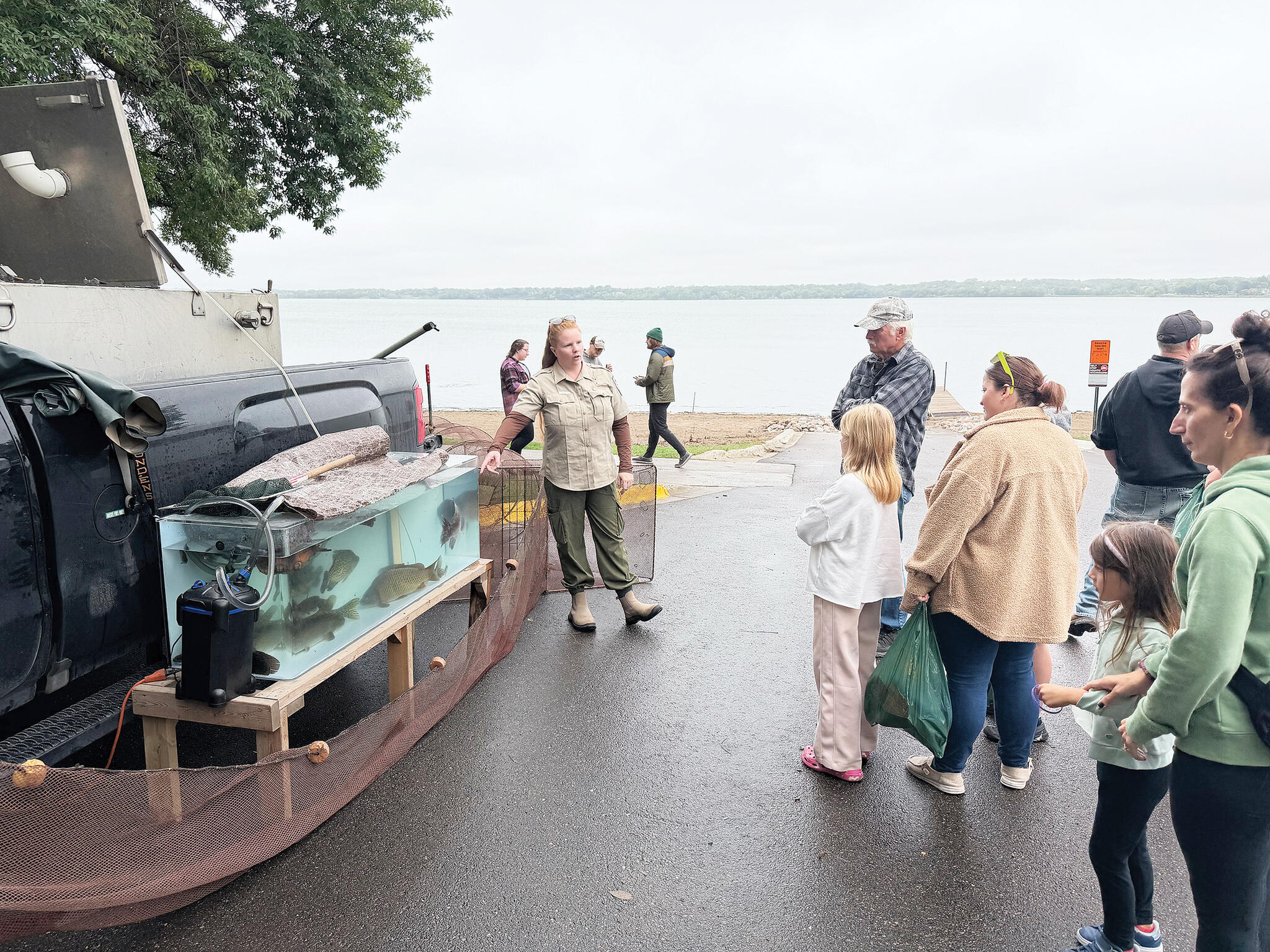 A DNR representative chatted with visitors about the variety of different fish species in Buffalo Lake. The fish in the tank were netted the day before and were released back into the lake at the conclusion of The Great Outdoor Fair.