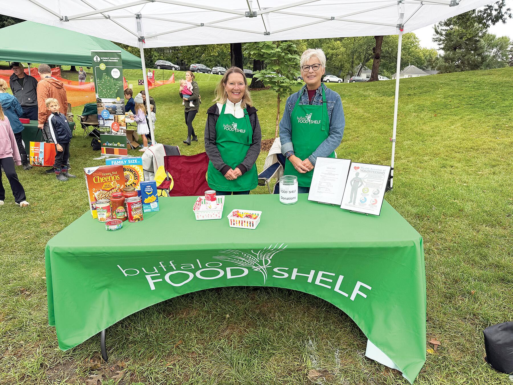 Buffalo Food Shelf Executive Director Laureen Bodin (left) and Associate Director Lori Olson (right) visited with those who stopped by their booth and provided information on volunteer opportunities.