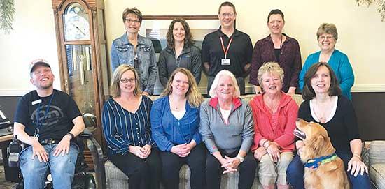 “Lakeside Oasis is so fortunate to have such dedicated volunteers,” says Stacy Kaluza, Care Outreach Manager. From left are volunteers and Lakeside staff: from left (back): Sue Olmscheid, Director of Nursing Jill Gustafson, Administrator Jason Nelson, Stacy Kaluza, Carol Kjesbo; (front): Tyler Pinot, Marilee Kramer, Adrienne Wojciak, Pat Jaeger, Laura Jones, Cheryl Larson, and Cheryl’s dog, Shima. (Submitted photo)