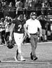 Steve Kiphuth (right) tends to Buffalo senior Trevor Johnson (left) during a home football game last fall. Kiphuth has served as Buffalo High School’s Head Athletic Trainer since December of 2014. (Photo by Rob LaPlante)