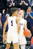Junior guard Antonio Bluiett (left) and senior forward Trevor Johnson (right) celebrate Buffalo’s 86-71 Section 8-4A semifinal victory over Moorhead last Saturday at St. Cloud Tech. (Photo by Rob LaPlante)