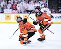 Delano teammates Jesse Peterson (left) and Gunnar Paulson (right) celebrate Peterson’s  opening goal in a 5-2 loss to Mahtomedi in the Class A state quarterfinal game on Wednesday, March 4, at Xcel Energy Center in St. Paul. (Photo by Brianna Burnham) 