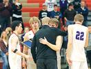 Buffalo seniors embrace Head Coach Josh Ortmann after receiving their Section 8AAAA runner-up trophy following last Thursday’s 54-52 loss to Maple Grove. Pictured (left-right): Brandon Maatz, Tony Dahl, Ortmann, Trevor Johnson, and Matthew Willert. (Photo by Rob LaPlante) 