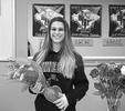 Buffalo High School senior Katie Horak (above) holds a bouquet of flowers in honor of her college national letter of intent she signed on Friday, Feb. 28 at Revolution Gymnastics in Rogers. Horak will be a Division-I gymnasts next season at the University of Minnesota. (Submitted photo)