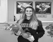 Buffalo High School senior Katie Horak (above) holds a bouquet of flowers in honor of her college national letter of intent she signed on Friday, Feb. 28 at Revolution Gymnastics in Rogers. Horak will be a Division-I gymnasts next season at the University of Minnesota. (Submitted photo)