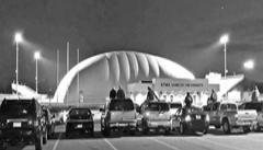The stadium lights outside St. Michael-Albertville High School shine bright above the dome, where the STMA stadium complex sits.